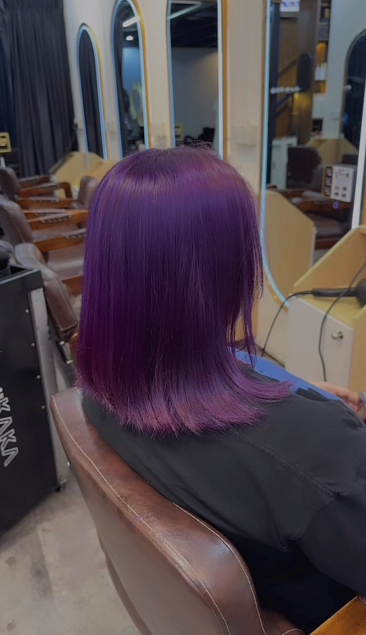 Soft styled bob reflected in a salon mirror